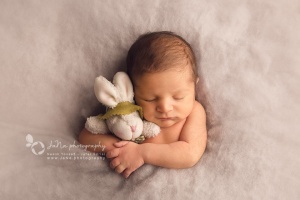 Vancouver Newborn Photography - Portrait of a Restful Newborn with their toy rabbit.