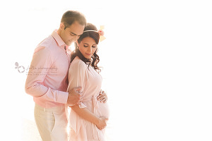Maternity photography couple poses in studio Vancouver
