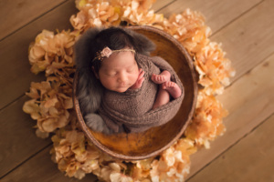 newborn photography - North Vancouver - in a brown basket full of flower