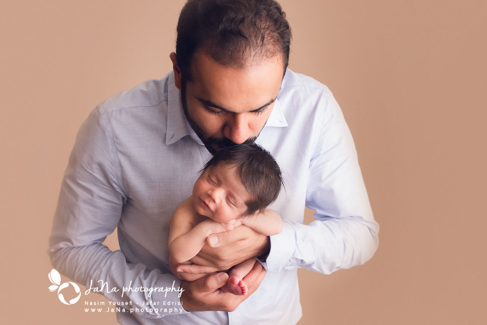 Newborn photography Burnaby - dad and baby - kiss