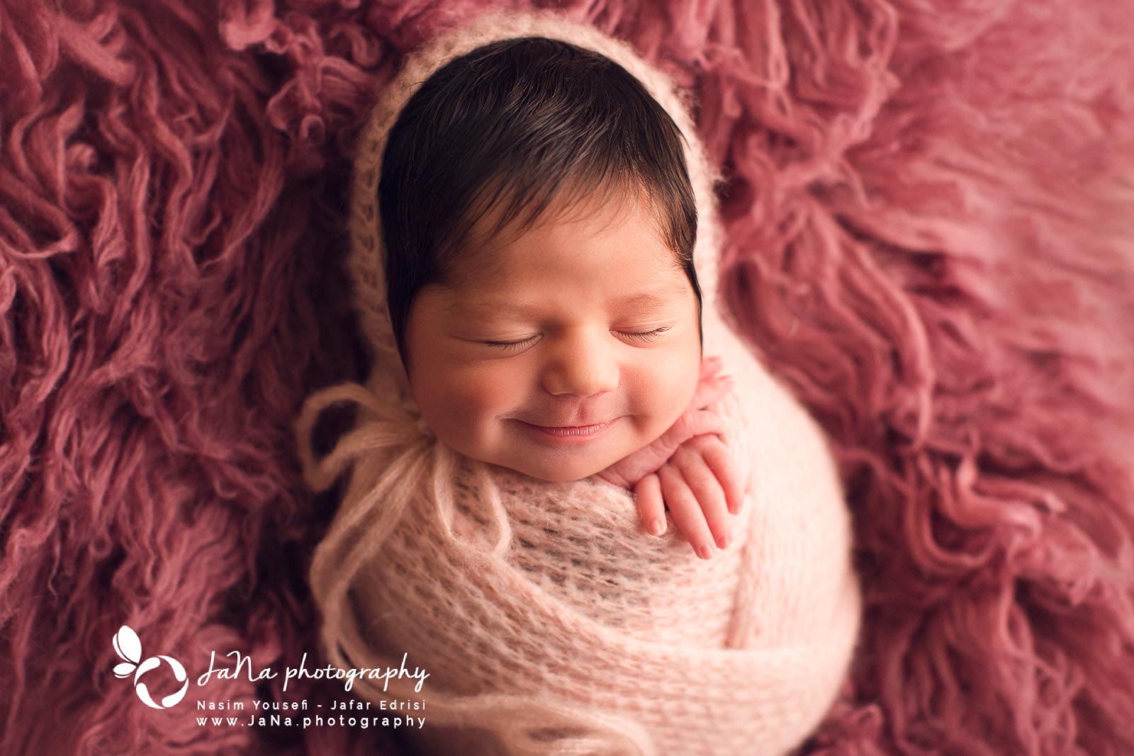 baby smiling while sleeping