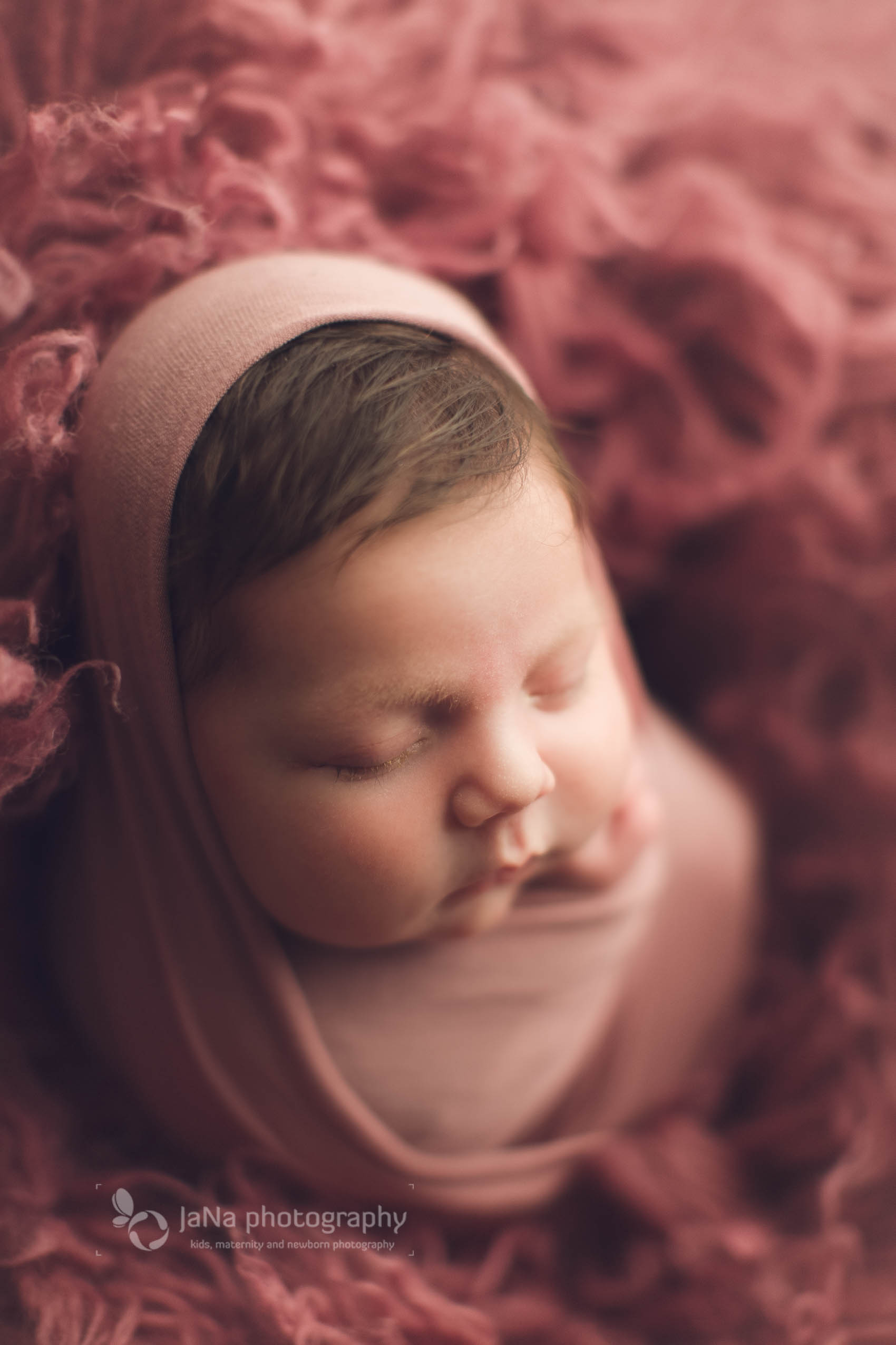 newborn photography classic package - baby girl full warp in a pink fur setup