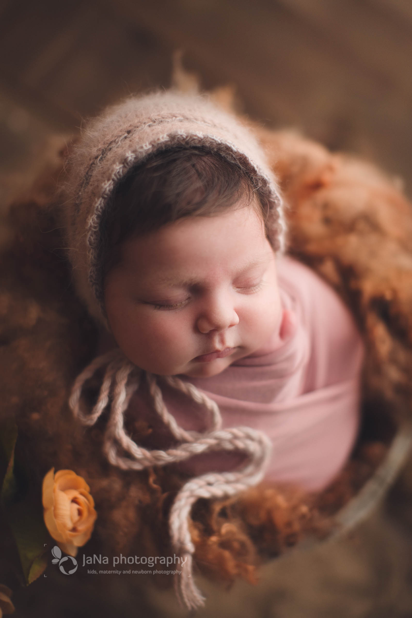 vancouver newborn photographer - baby girl sleeping in a brown setup 