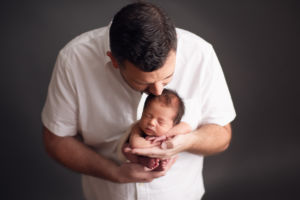 Vancouver newborn photography - dad and baby kiss