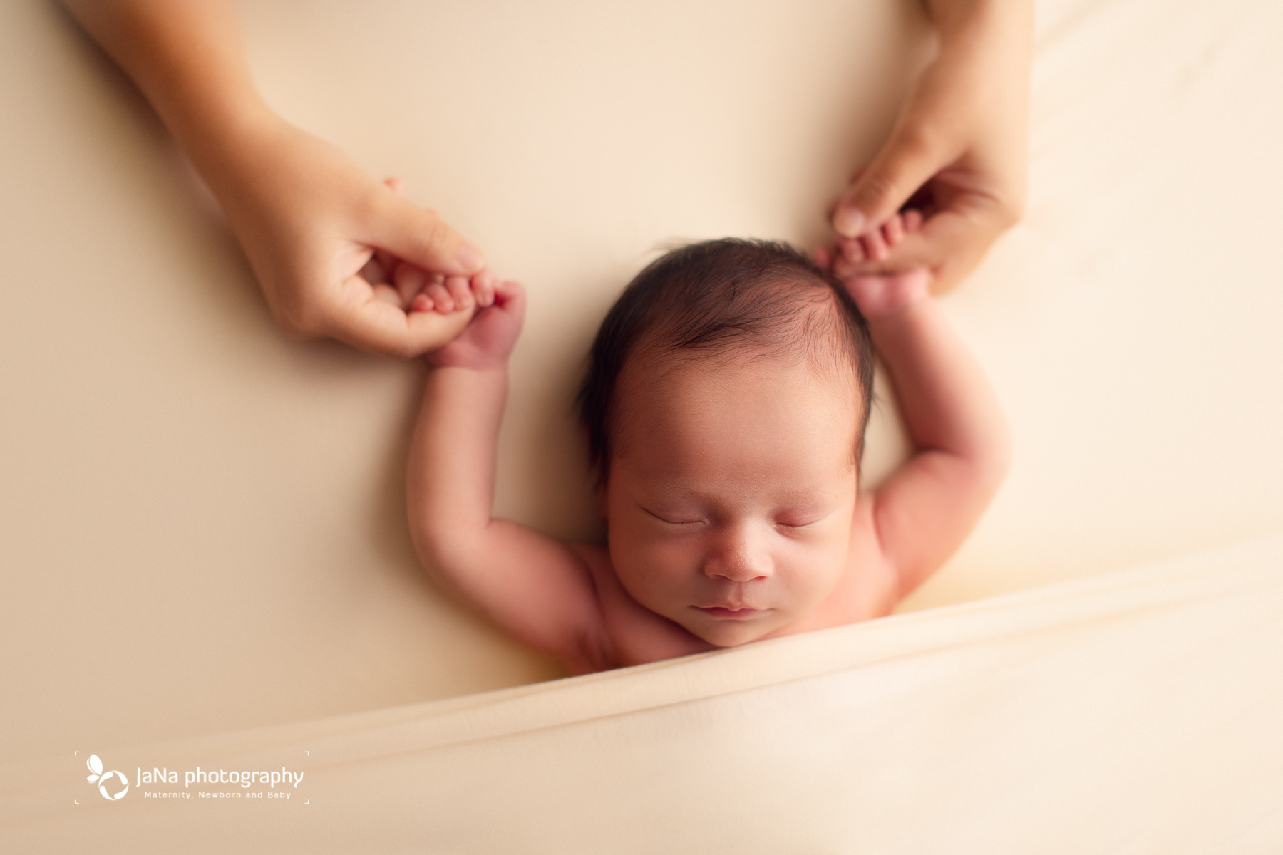 best newborn photographer in Vancouver- dad is holding newborn's hand