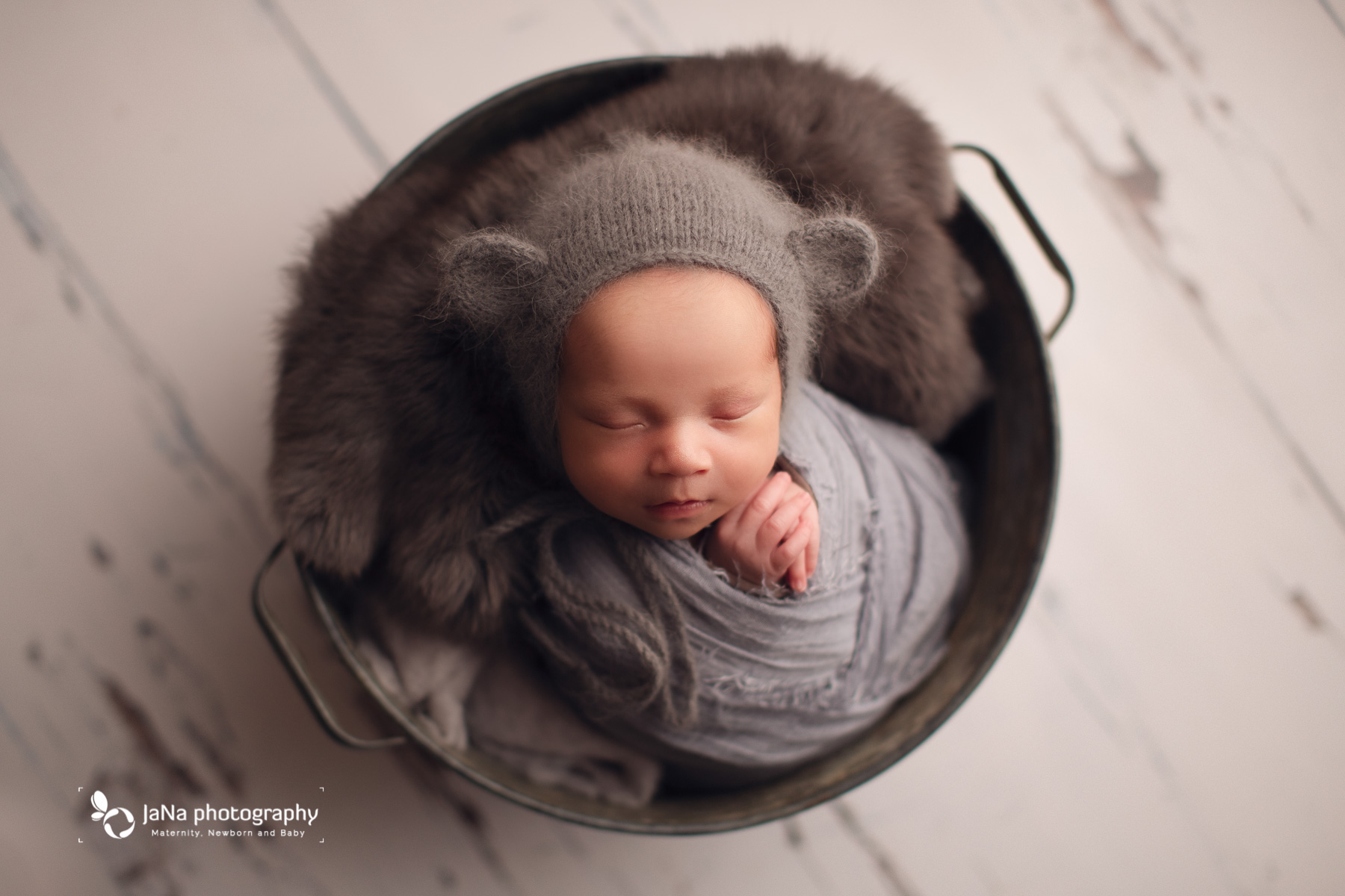 gray setup for newborn and bear hat