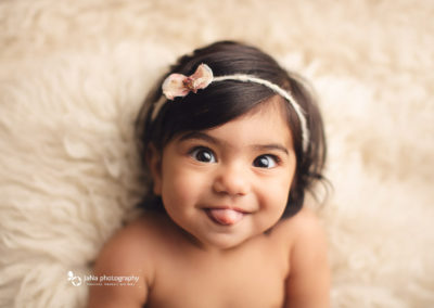 cute baby girl - looking to camera - jana photography