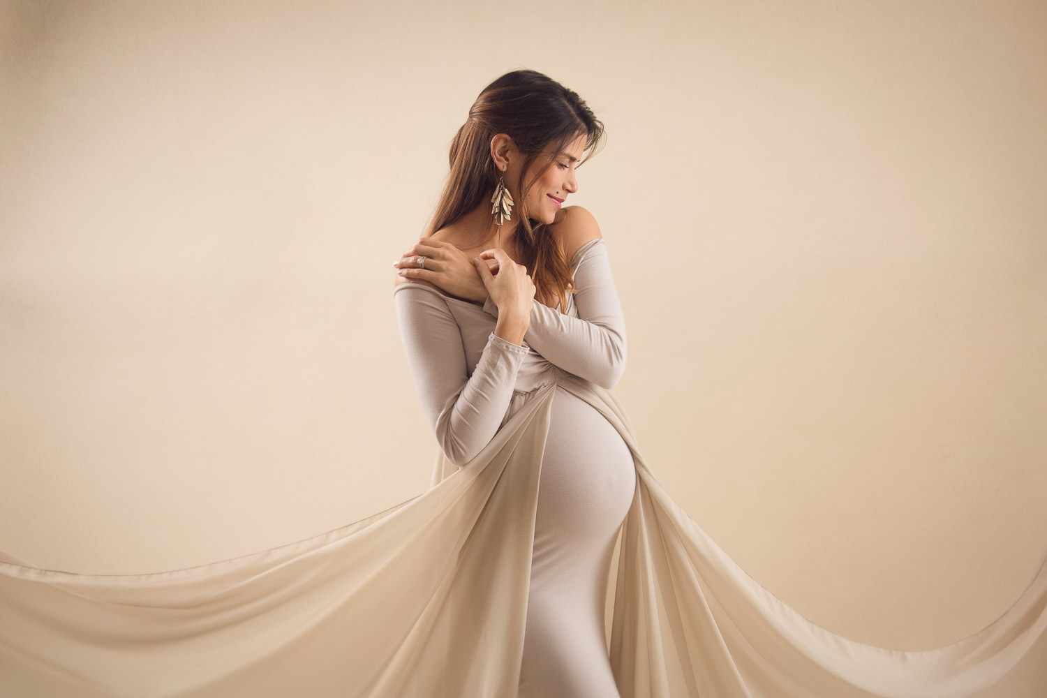 the best pose for maternity shoot with long with a long tail design, sexy yet elegant