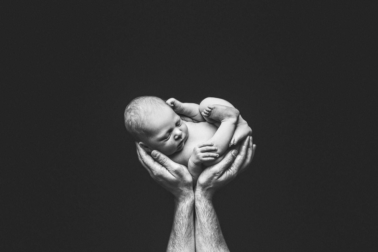 black and white baby boy and dad hand | Jana photography