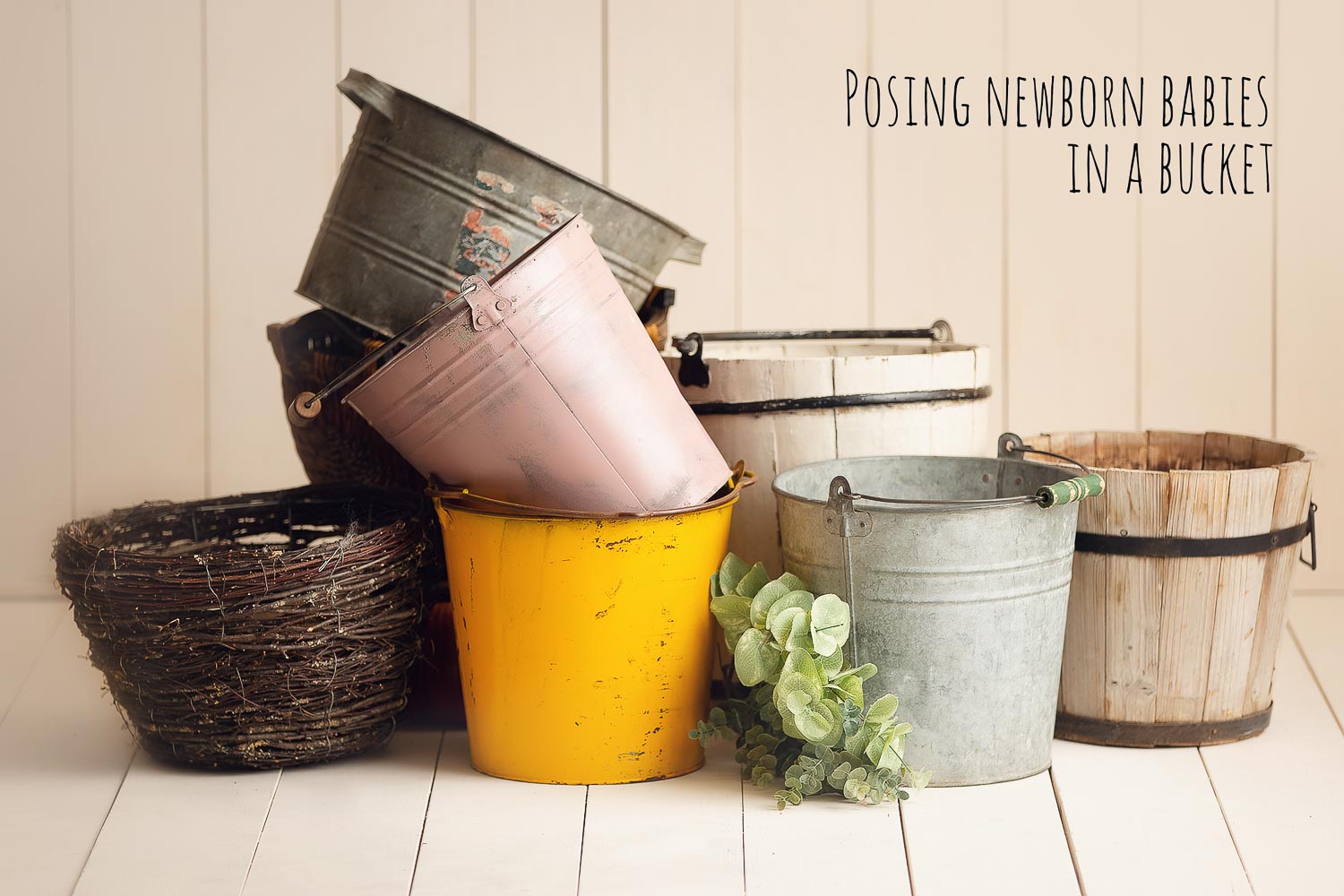 colourful bucket for posing newborn babies inside .             