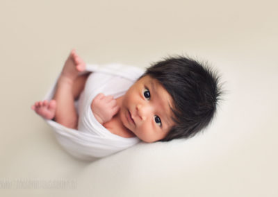 newborn baby boy - open eyes - black hair
