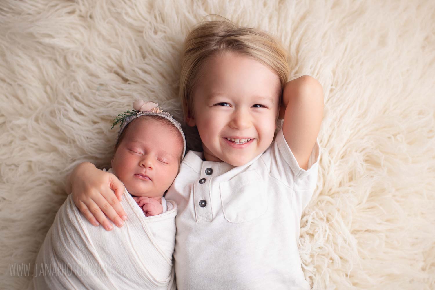 newborn photography with siblings - sister and brother - white setup 