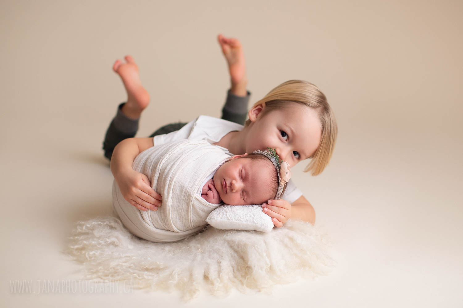 newborn photography with siblings - sister and brother - white setup 