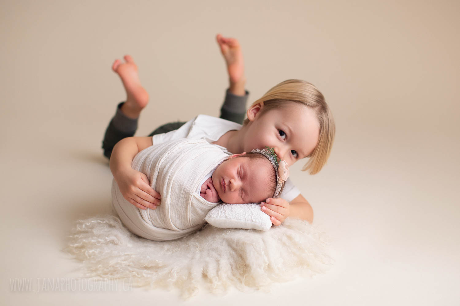 newborn photography with siblings - sister and brother - white setup