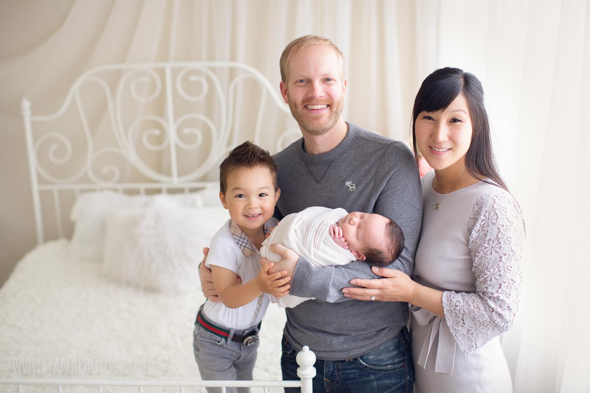 family holding their newborn baby boy - natural light photography