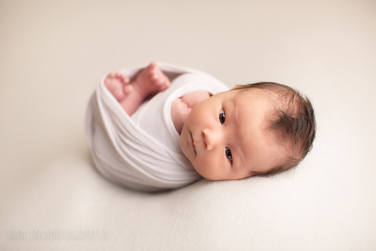 open eyes newborn baby boy in a white background - newborn photography jana