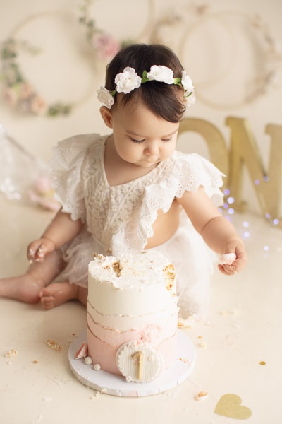 cake smash photography girl cream and gold