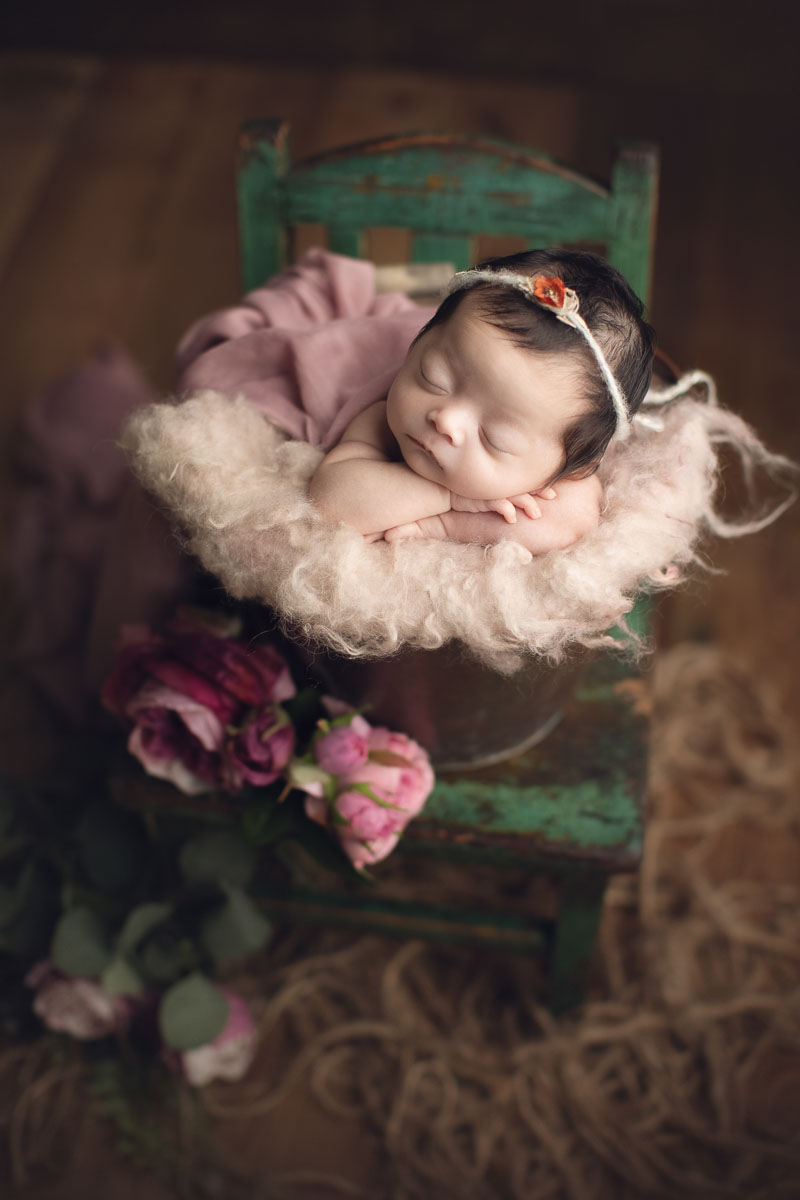 newborn baby girl in bucket