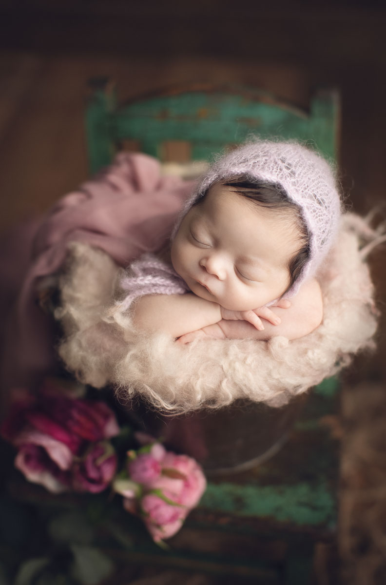 newborn baby girl in bucket