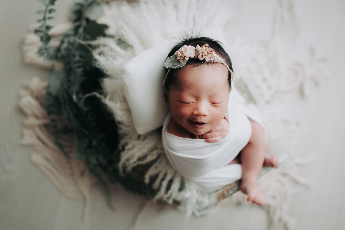 newborn photography smile baby girl