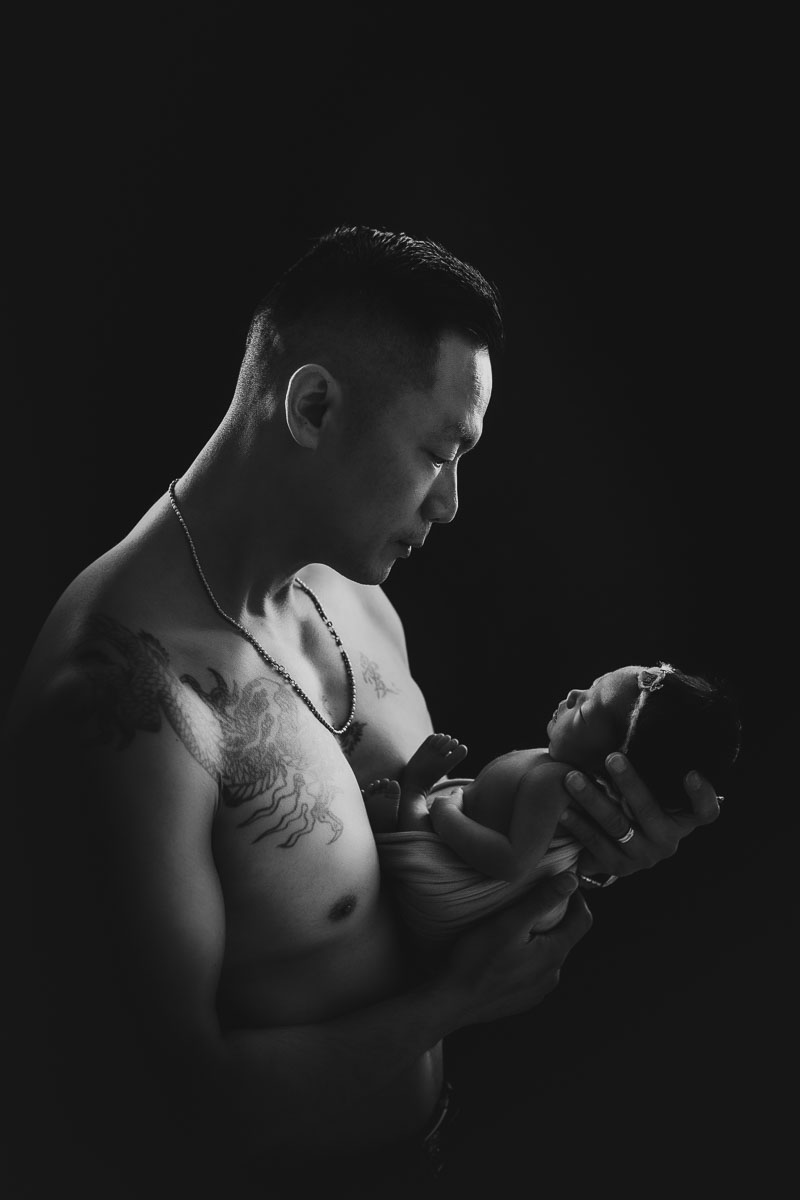 newborn baby girl and dad with tattoo