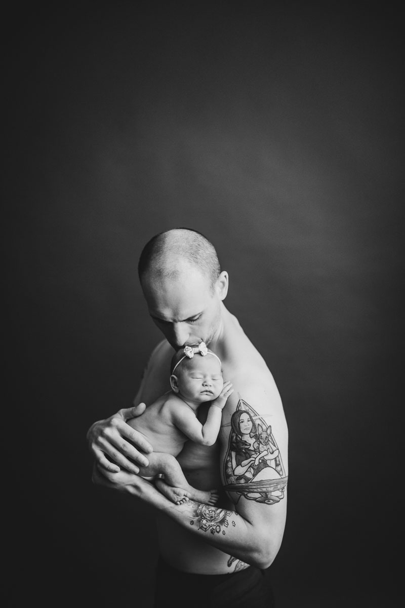 newborn photography with dad and tattoo black and white 