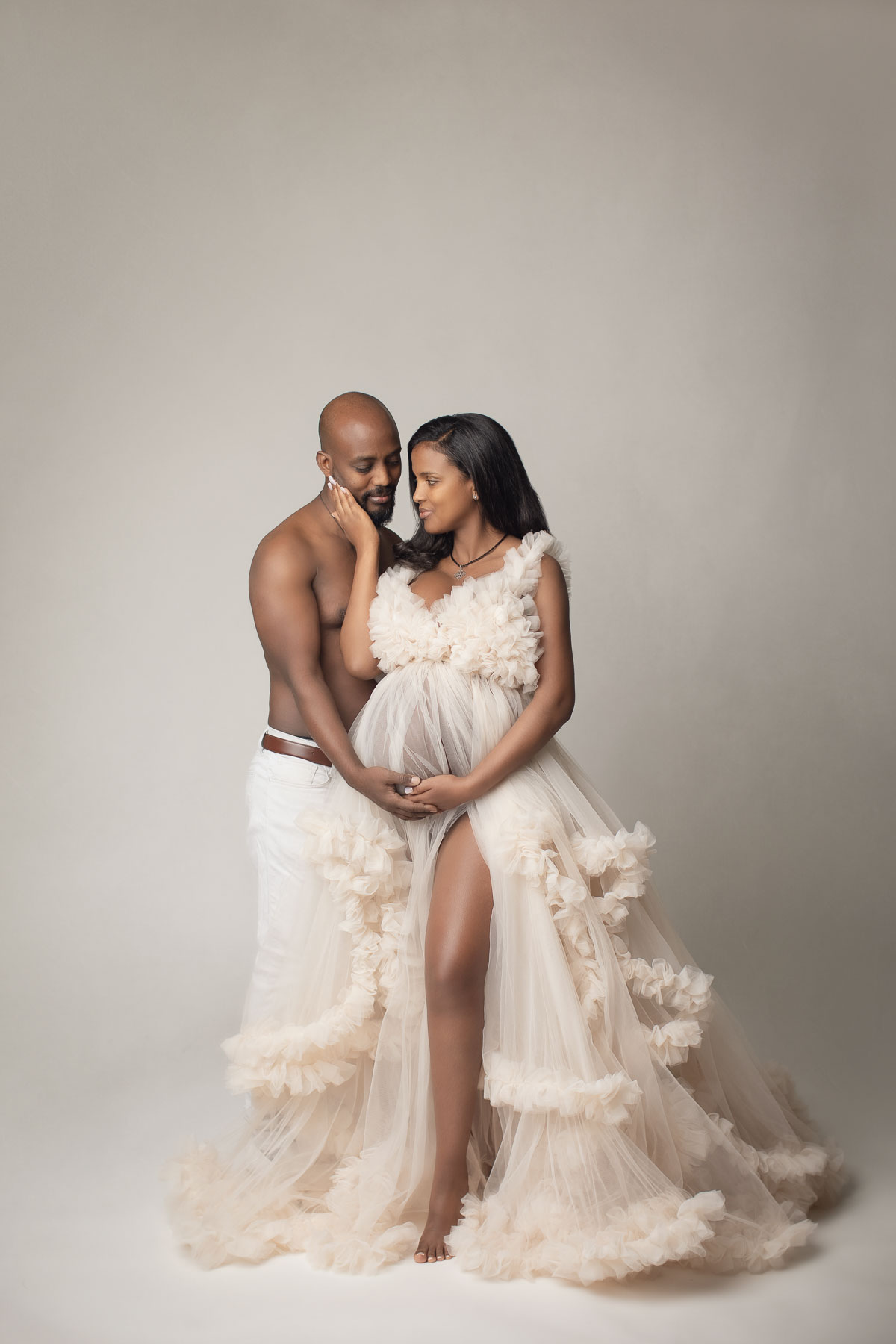 stunning couple pregnancy photo with blush color couture maternity gown
