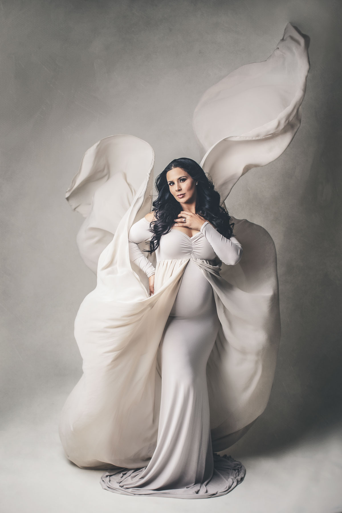 the most beautiful maternity photoshoot with long flying pregnancy gown