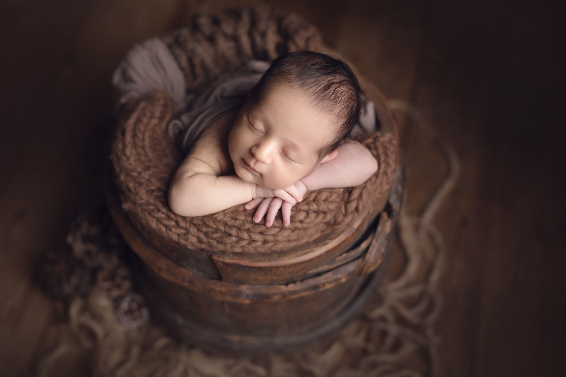 newborn photography Vancouver - burnaby and surrey - baby boy on a brown bucket