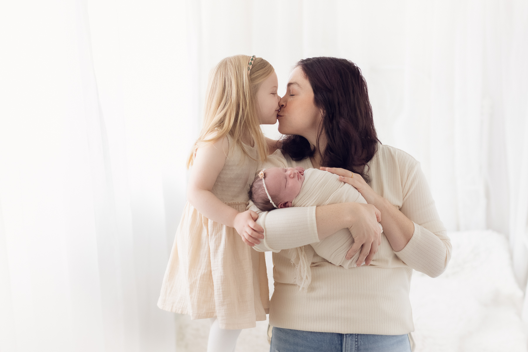 mom and 2 girls in a natural light studio- newborn photography classic package best newborn photography studio in vancouver