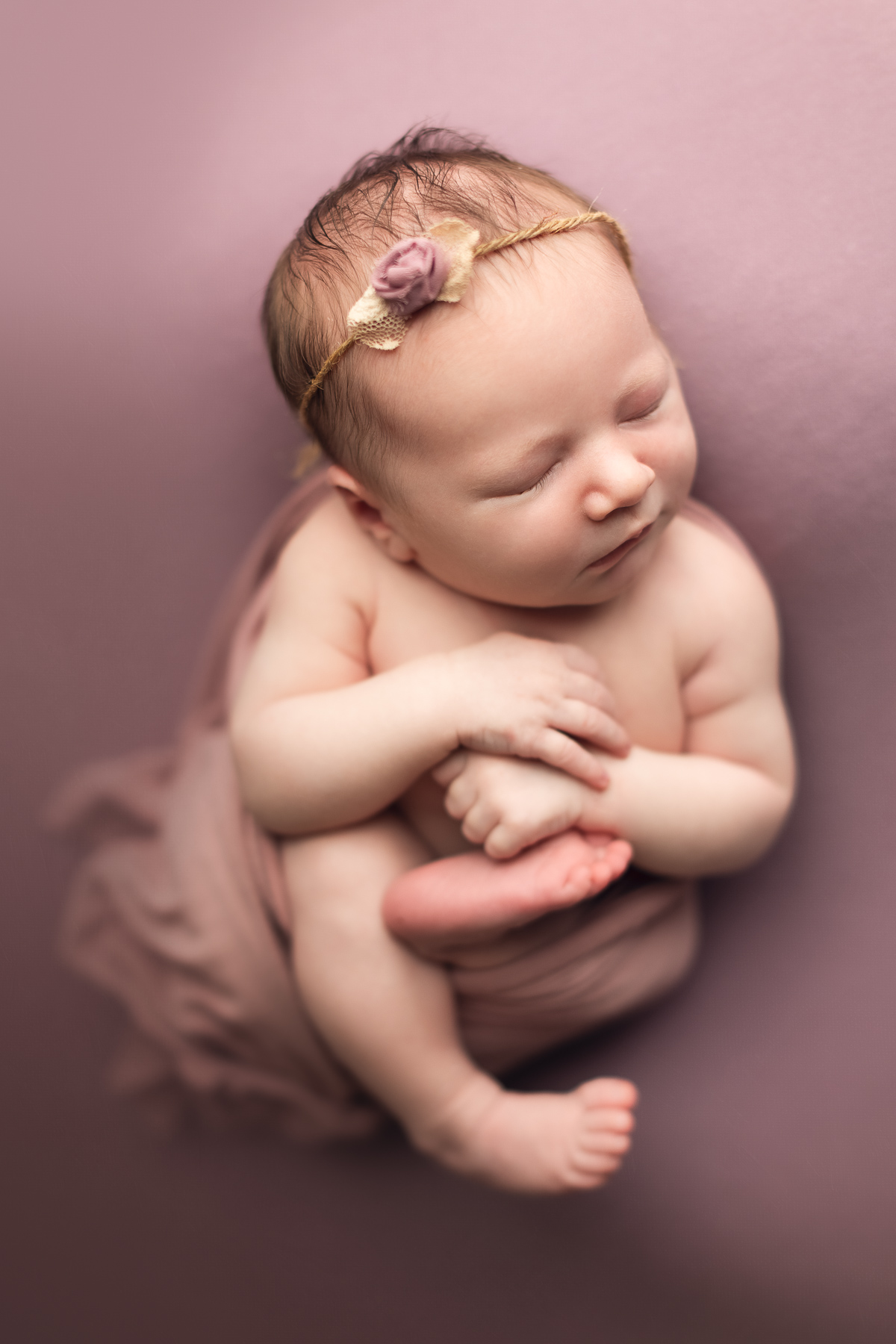 newborn photography classic package sample - baby girl with pink background and headband