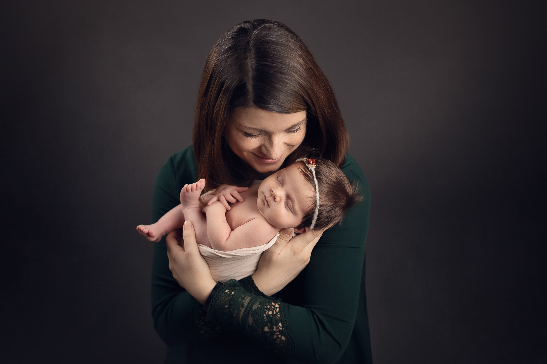 mommy and newborn photography in black background