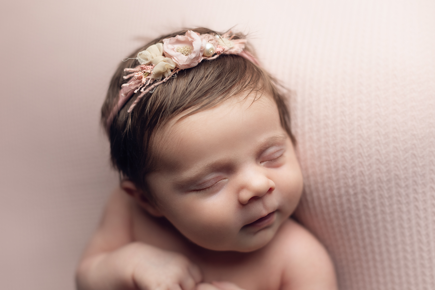 newborn photographer in vancouver - surrey - baby girl pink background headband