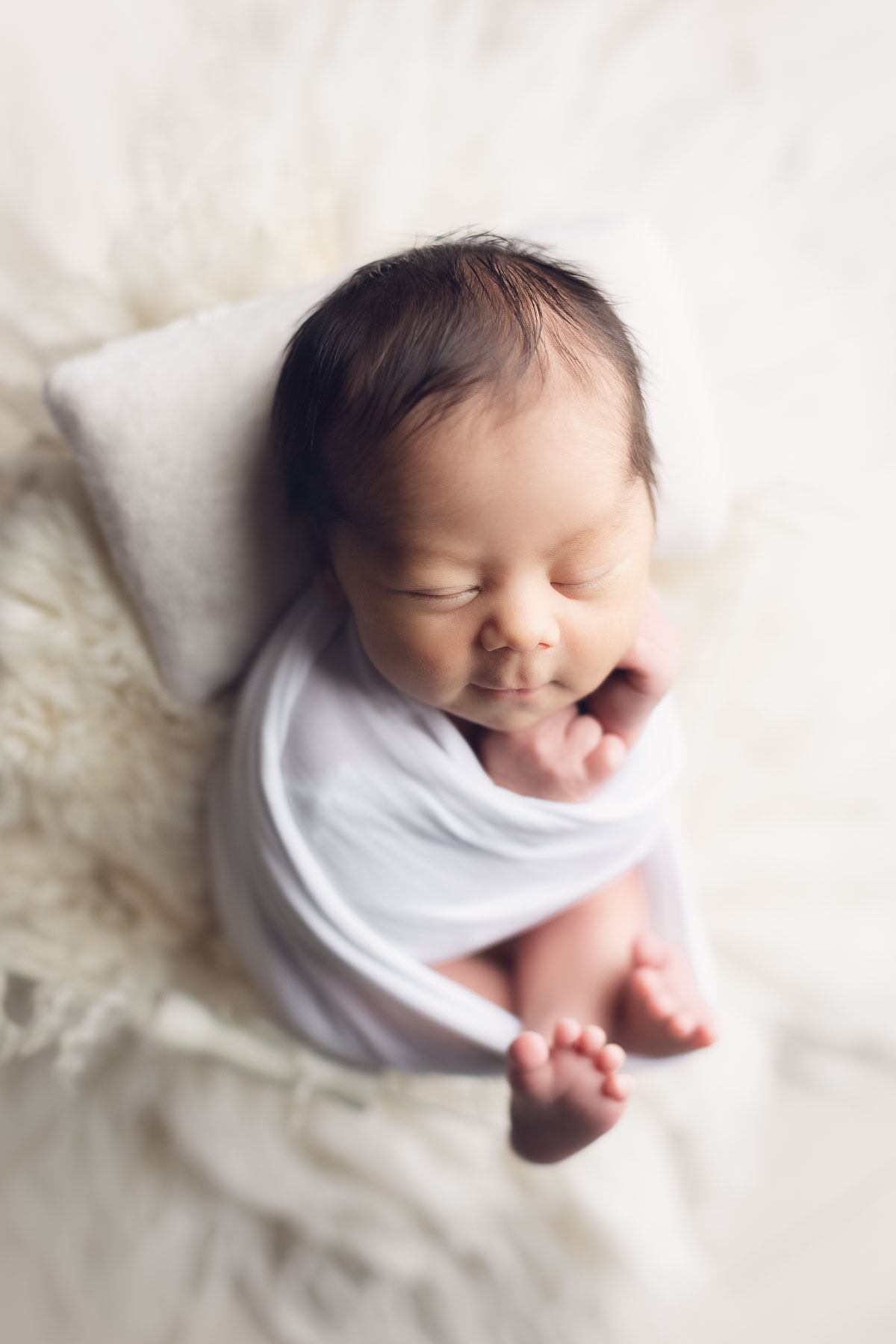 newborn baby smiling