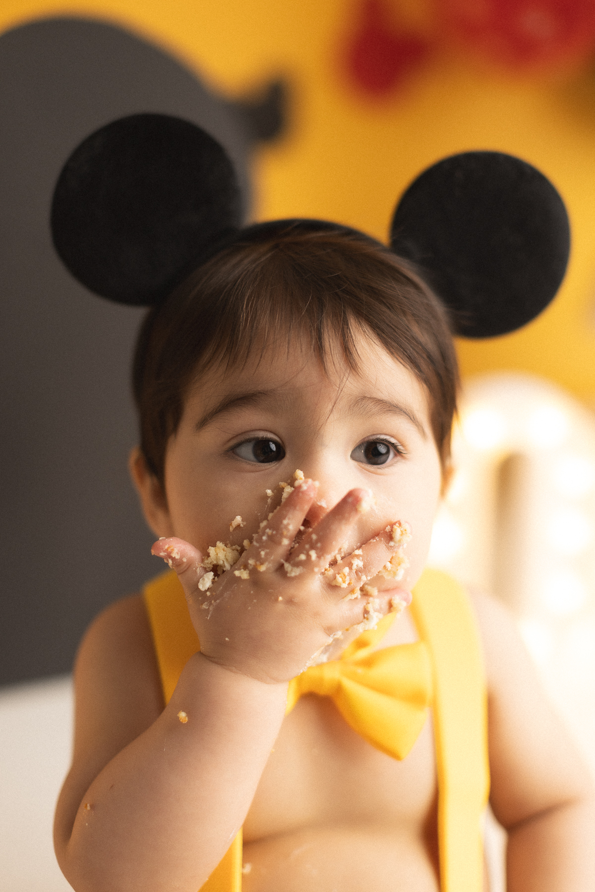 Child enjoying a cake smash celebration