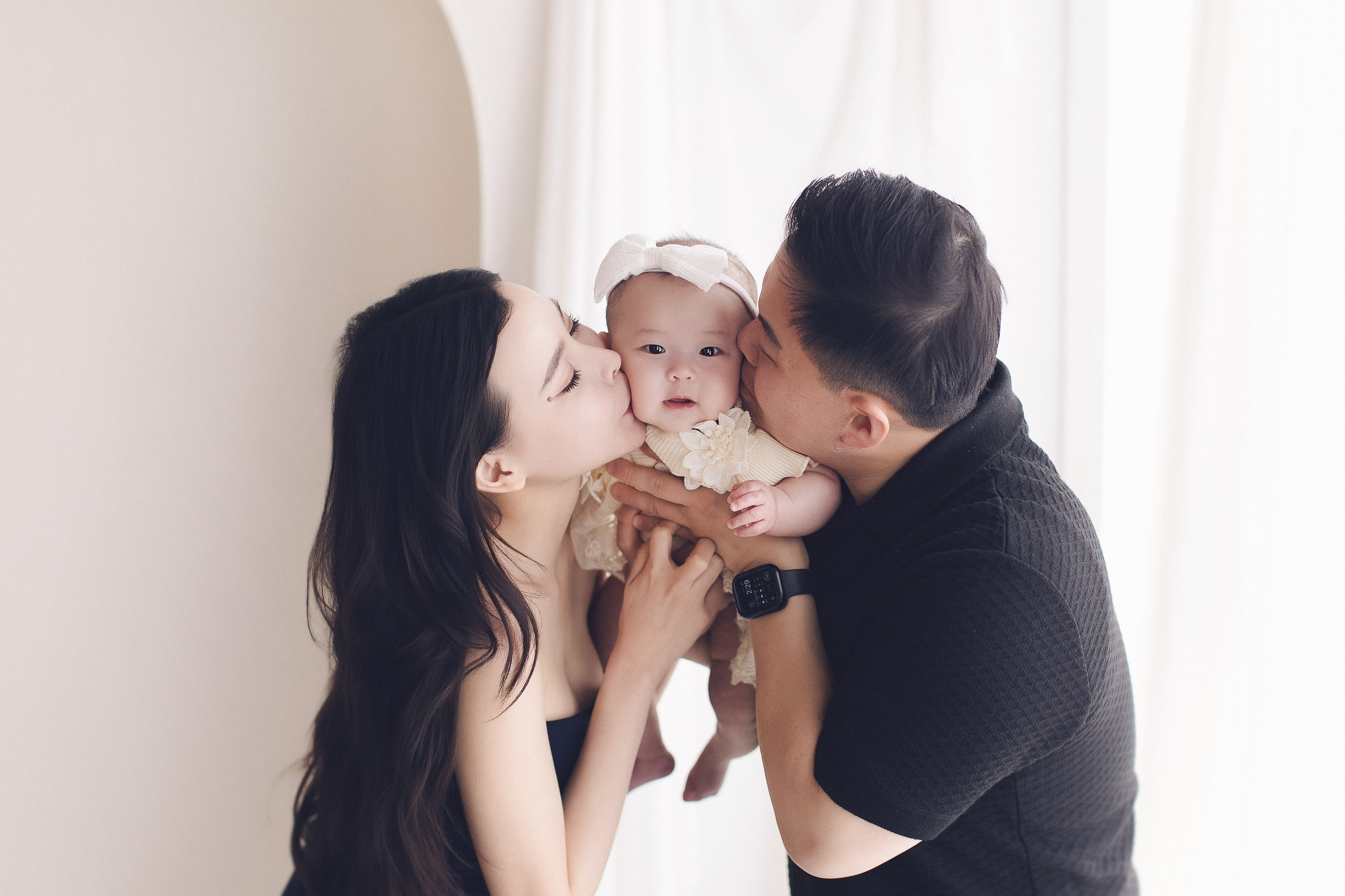 100 Days Baby Photography Vancouver family holding 100-day baby portrait