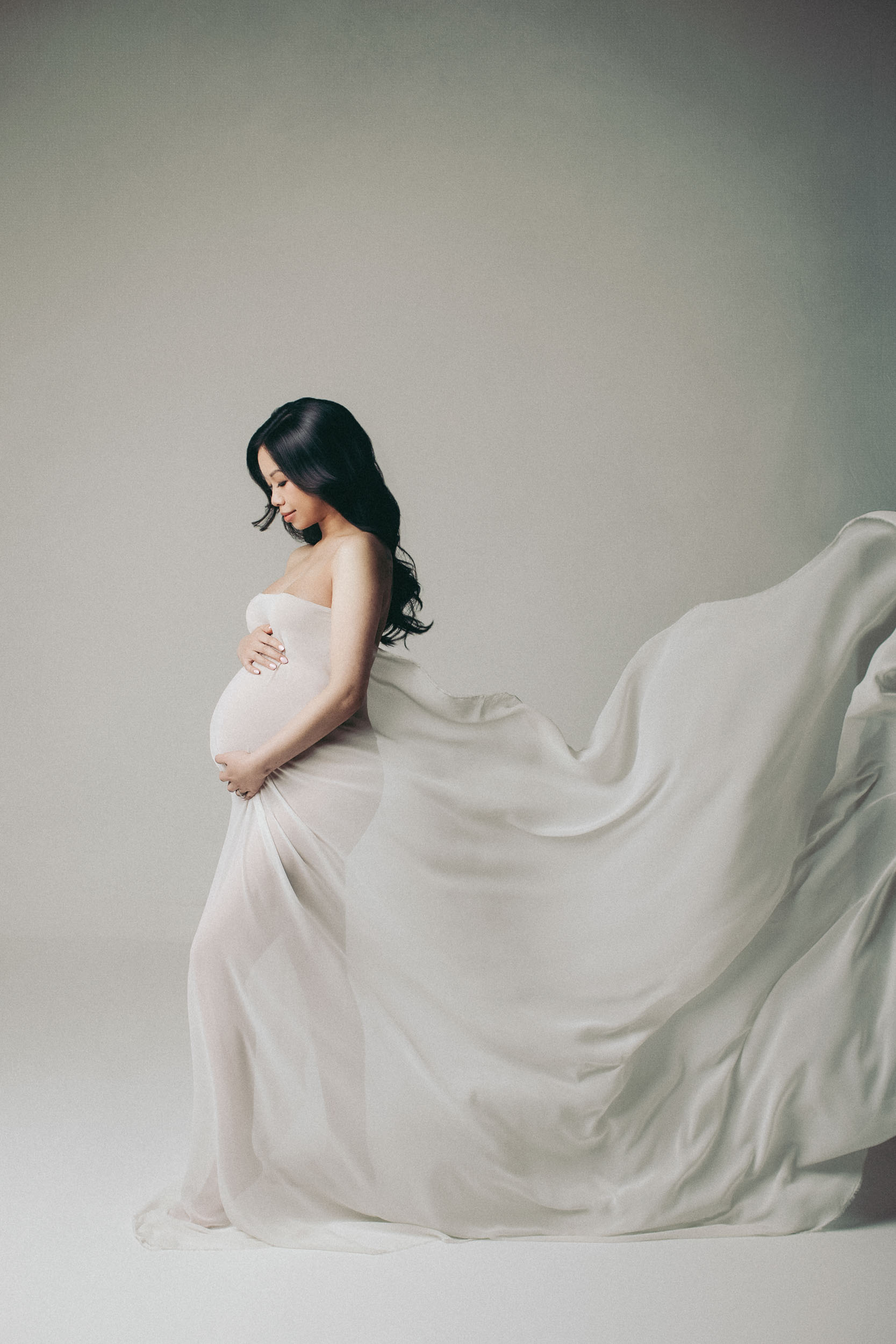 Pregnant woman in flowing dress.
