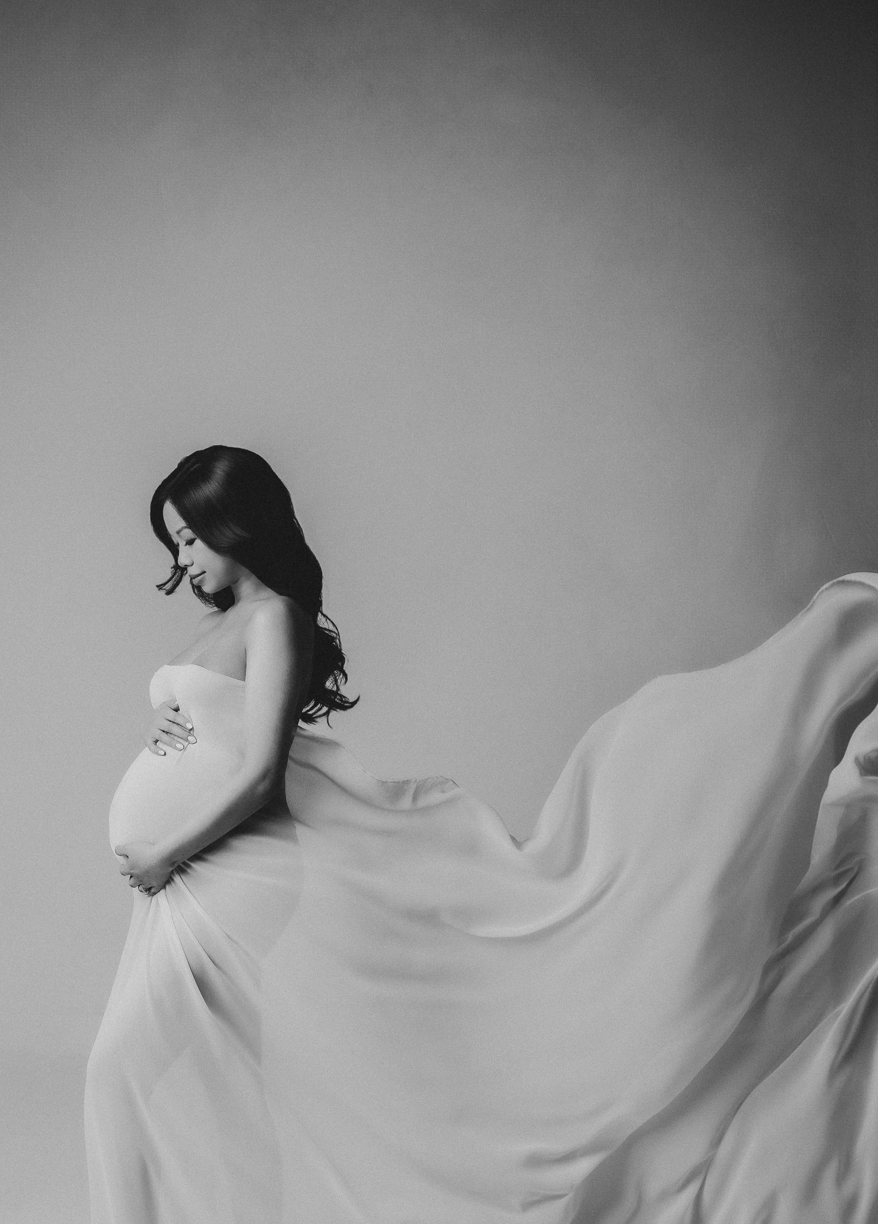Pregnant woman in flowing dress