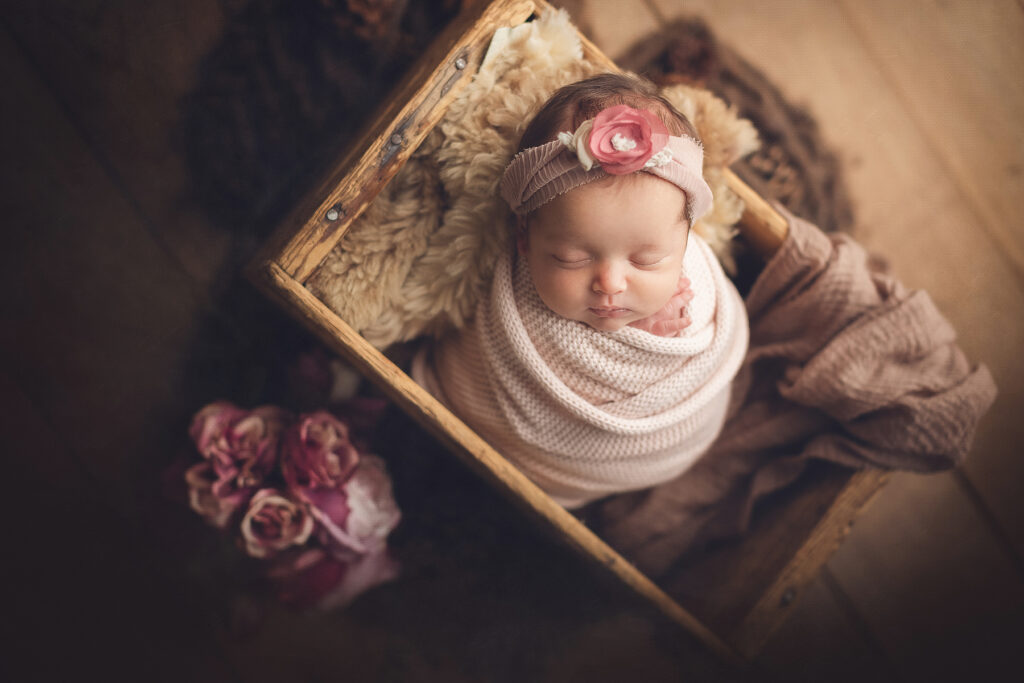 Newborn baby in floral wrap by Burnaby newborn photographer Jana Photography