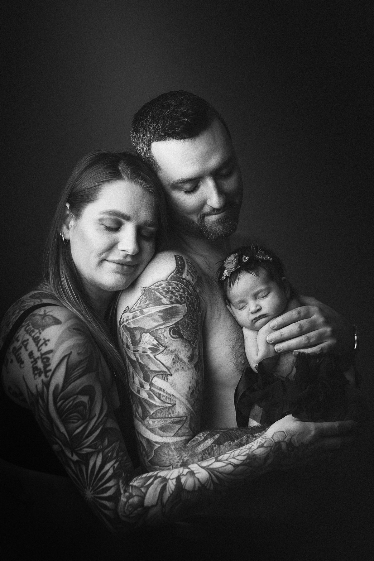 Newborn photography cost Vancouver — father holding newborn baby