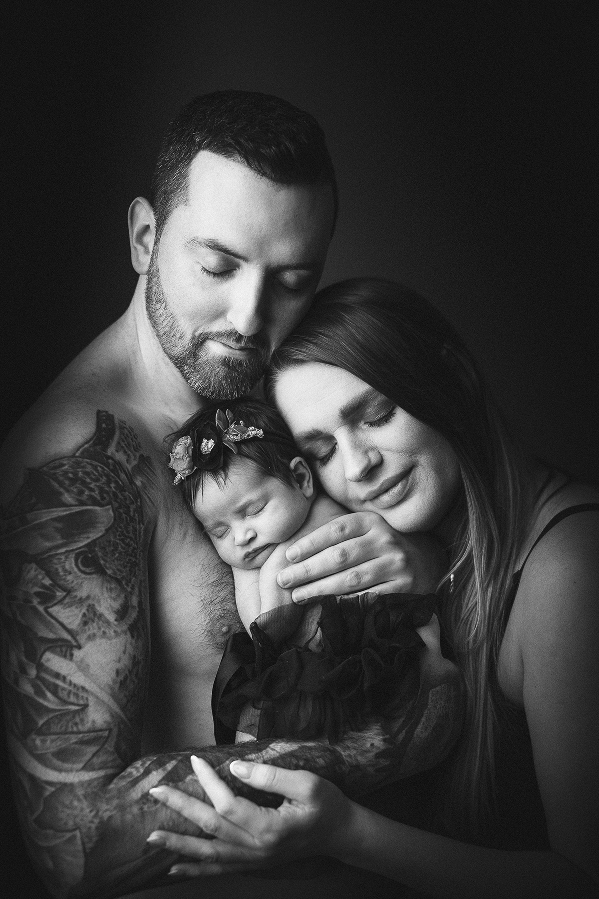 Newborn photography Vancouver pricing — parents holding newborn baby