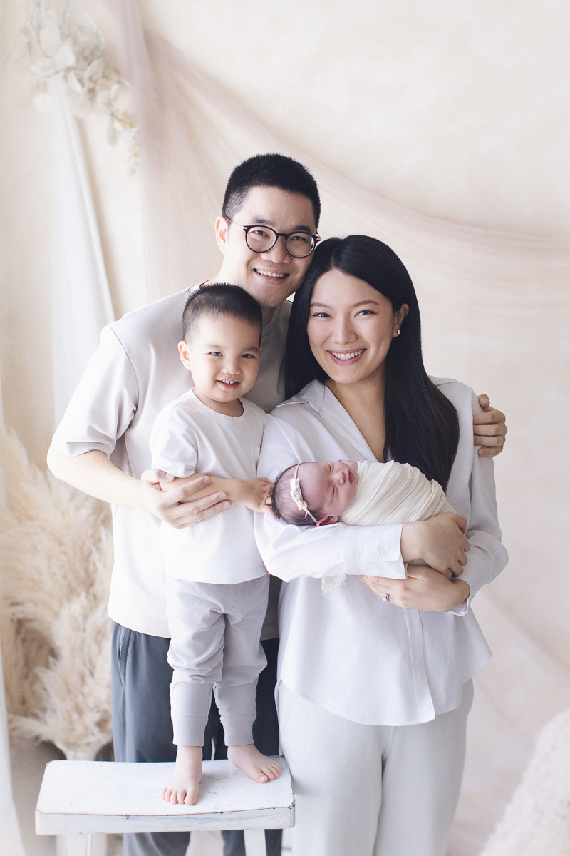 Vancouver newborn photography session — family portrait with parents, sibling, and newborn
