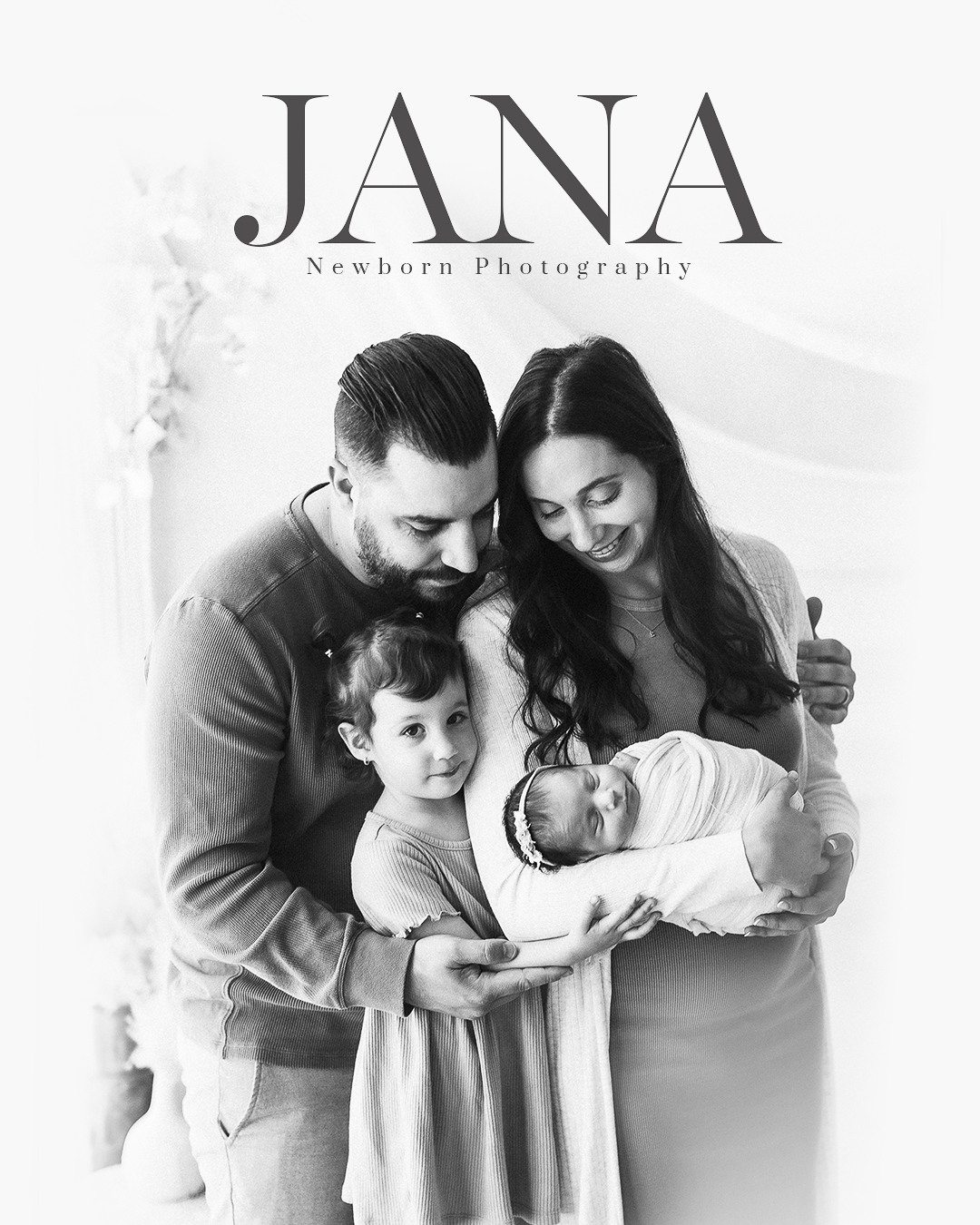 Family embracing their newborn and toddler during a Vancouver newborn photography session